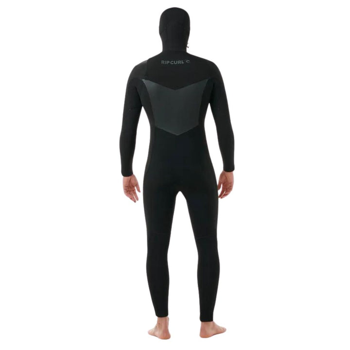 A male model wearing a Rip Curl Dawn Patrol 5/4mm black mens hooded wetsuit with a chest zip feature and yulex rubber. View of the back