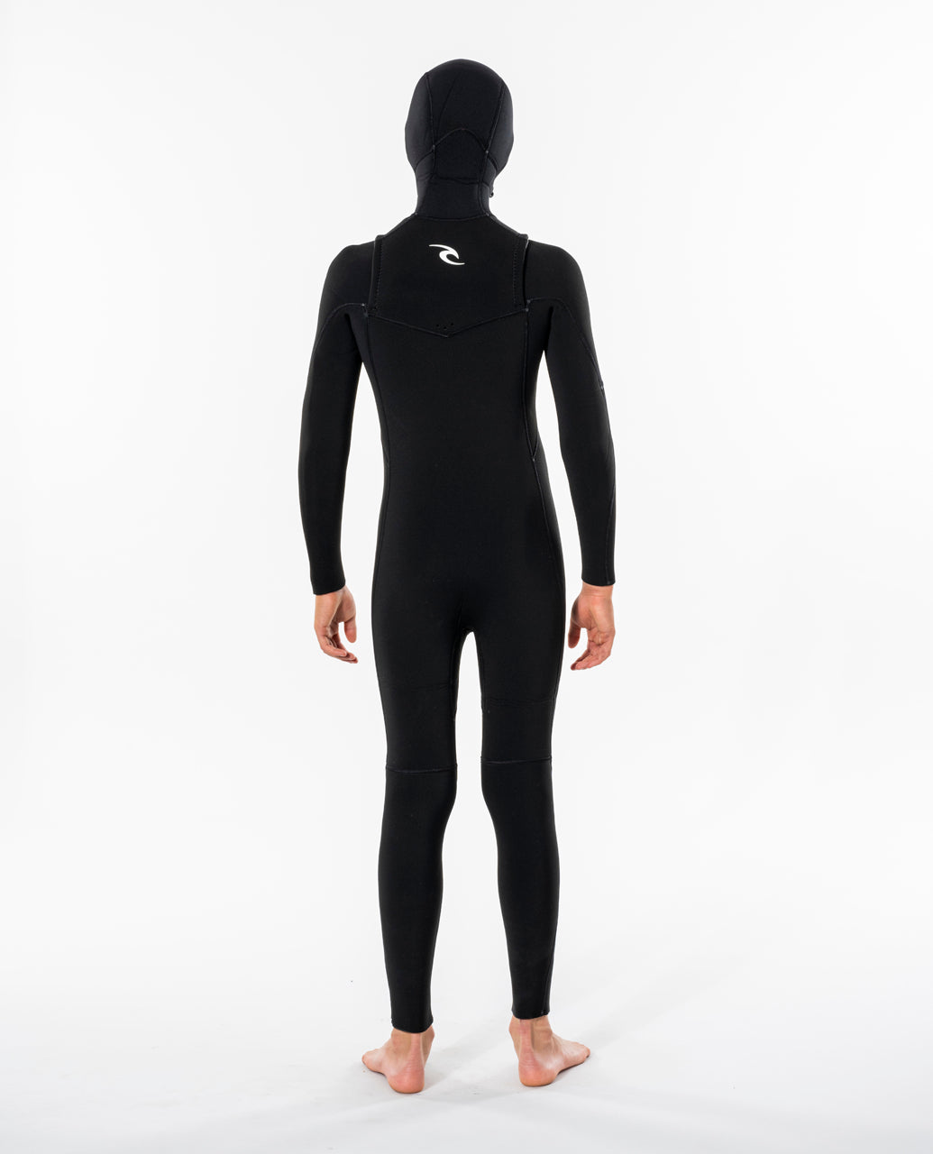 Back view of model wearing black Rip Curl Dawn Patrol kids hooded wetsuit