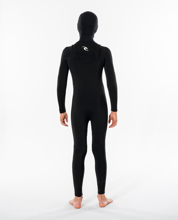 Back view of model wearing black Rip Curl Dawn Patrol kids hooded wetsuit