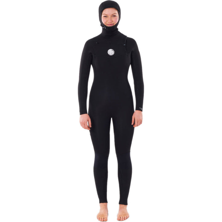 A woman wearing a Rip Curl black hooded chest zip wetsuit, designed for water sports. Front view. 